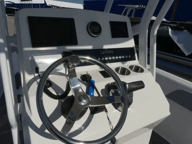 Slide: The Image of Control console of a 2018 Carrera Sport Fishing boat. - 32