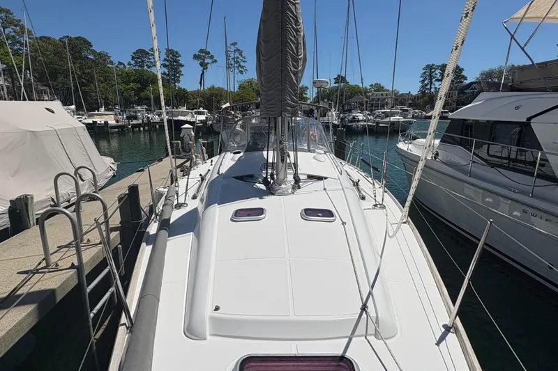 Slide: The Image of 2008 Wauquiez Centurion 40s sailboat docked at a marina, surrounded by other boats. - 11