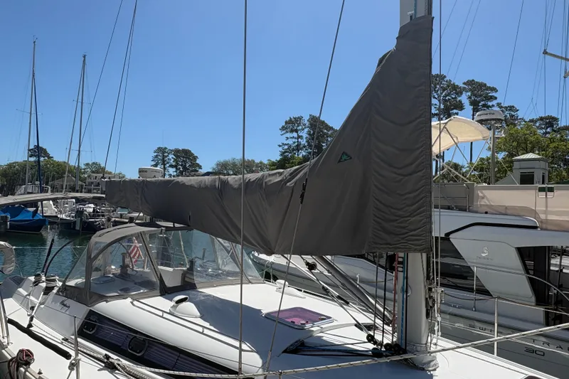 Slide: The Image of 2008 Wauquiez Centurion 40s sailboat docked at a marina under clear blue skies. - 12