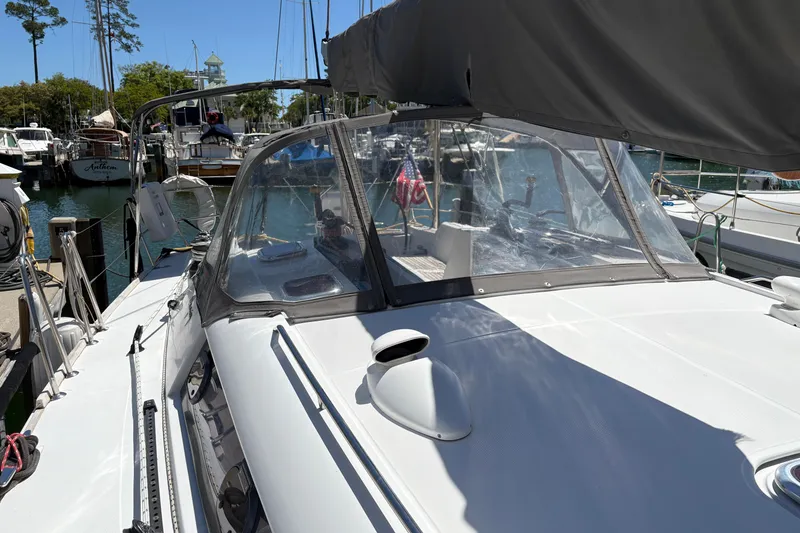 Slide: The Image of 2008 Wauquiez Centurion 40s sailboat docked in a marina under clear skies. - 16