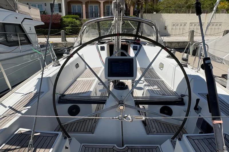Slide: The Image of 2008 Wauquiez Centurion 40s sailboat cockpit with steering wheel and navigation display. - 21