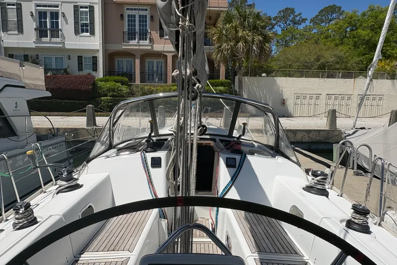 Slide: The Image of Cockpit view of a 2008 Wauquiez Centurion 40s sailboat docked at a marina. - 22