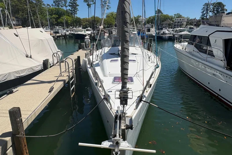 Slide: The Image of 2008 Wauquiez Centurion 40s sailboat docked at marina, surrounded by other boats. - 3