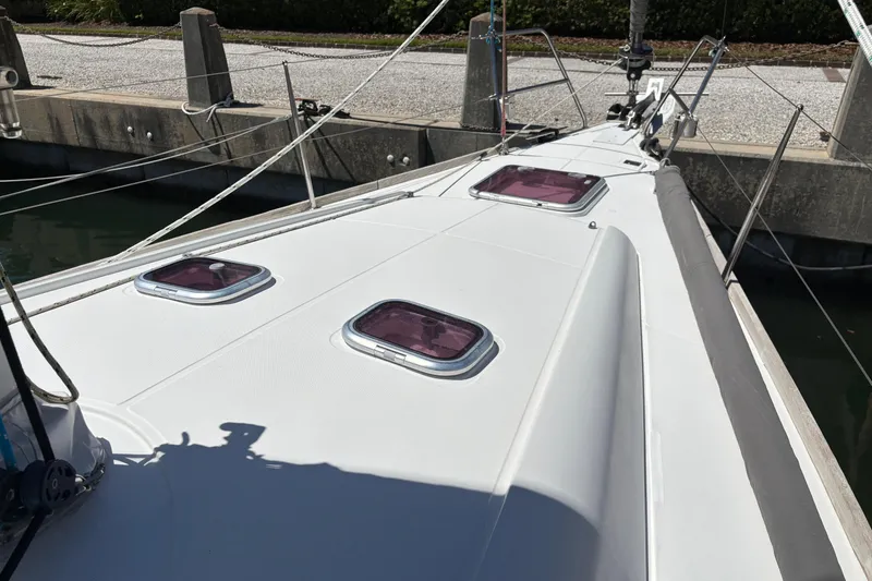 Slide: The Image of 2008 Wauquiez Centurion 40s yacht deck with hatches, docked at marina. - 8