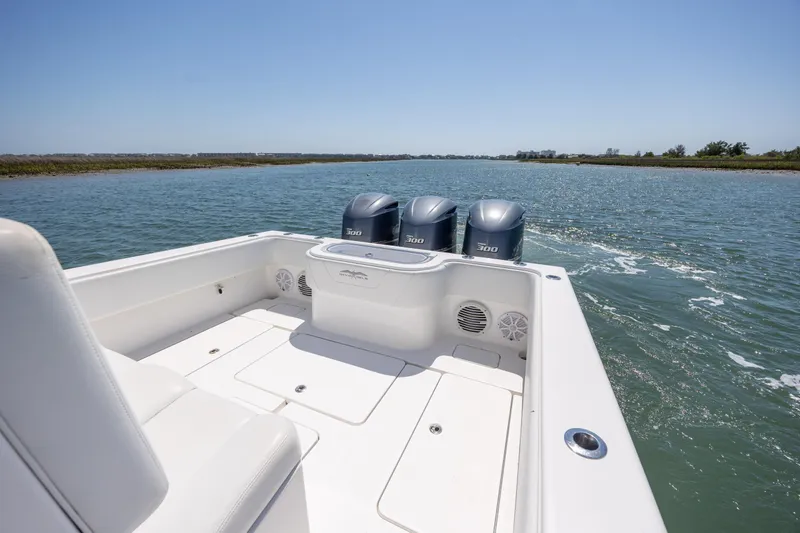 Slide: The Image of 2019 Invincible 36 Open Fisherman boat with triple 300 horsepower engines on a sunny day. - 10