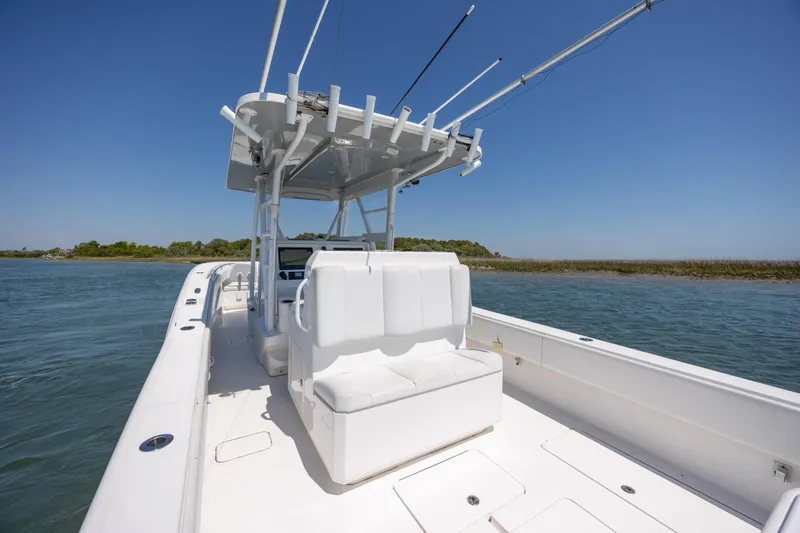 Slide: The Image of 2019 Invincible 36 Open Fisherman boat on calm waters under clear blue sky. - 13