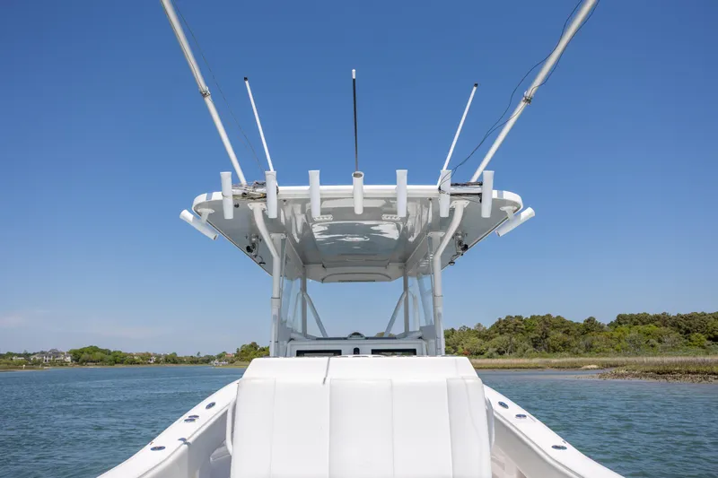 Slide: The Image of 2019 Invincible 36 Open Fisherman boat on calm water, clear sky background. - 14