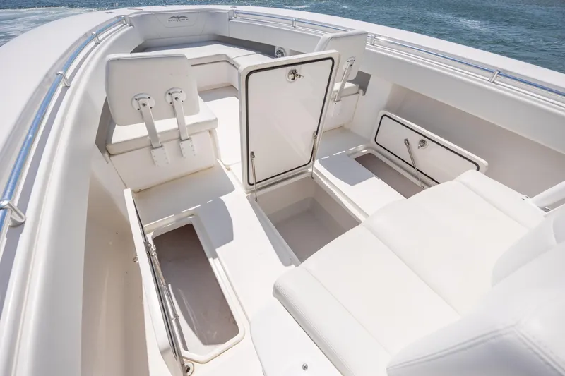 Slide: The Image of 2019 Invincible 36 Open Fisherman boat interior with storage compartments and seating. - 27