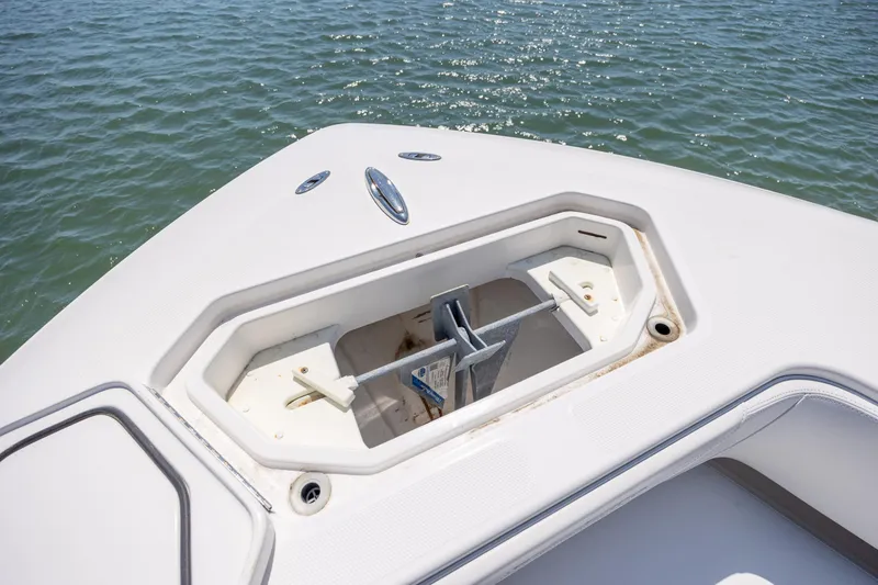 Slide: The Image of Bow anchor compartment of 2019 Invincible 36 Open Fisherman on calm water. - 28