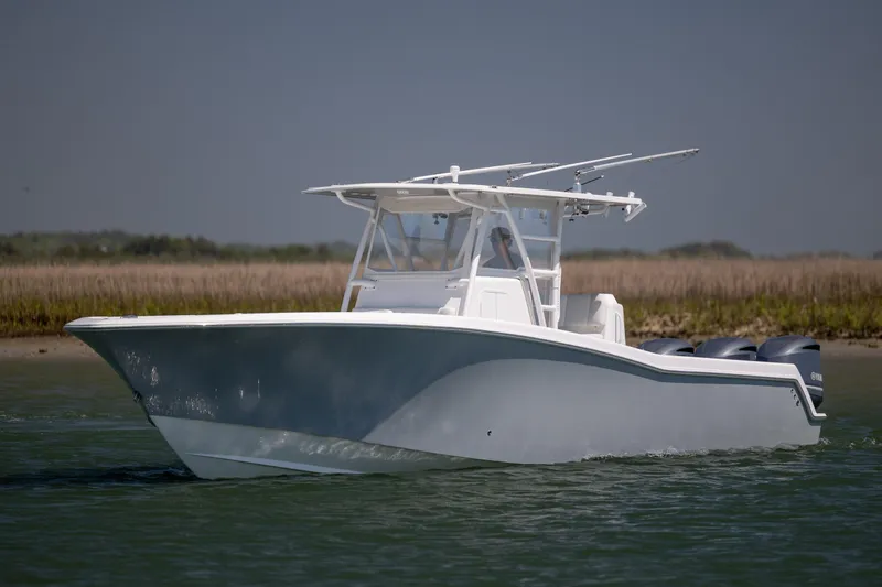 Slide: The Image of 2019 Invincible 36 Open Fisherman boat cruising on calm water. - 3