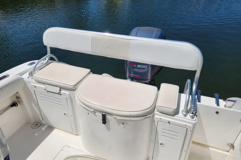 Slide: The Image of 2001 Cobia 234 Center Console boat with seating and V6 200 engine. - 10