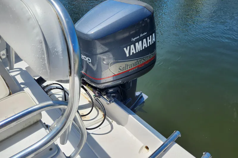 Slide: The Image of 2001 Cobia 234 Center Console with Yamaha outboard engine on water. - 11