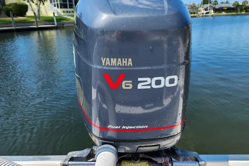 Slide: The Image of Yamaha V6 200 outboard motor on 2001 Cobia 234 Center Console boat. - 12