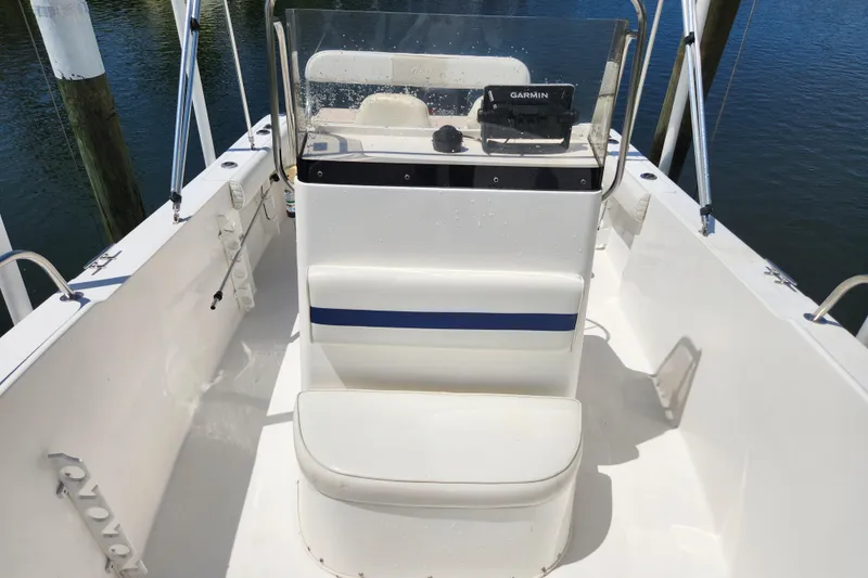 Slide: The Image of 2001 Cobia 234 Center Console boat interior with Garmin navigation system. - 6