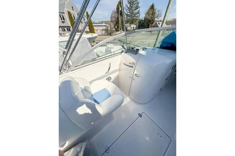 Slide: The Image of 2022 Robalo R227 Dual Console boat interior with white seating and console. - 14