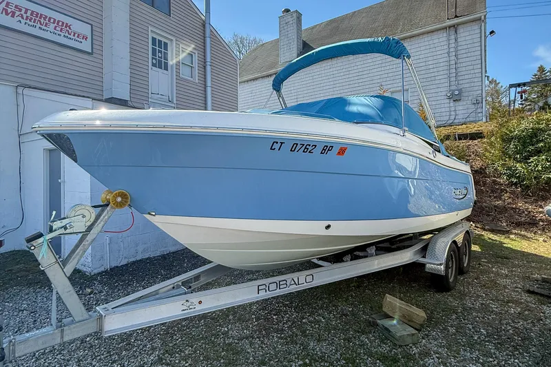 Slide: The Image of 2022 Robalo R227 Dual Console boat on trailer at Westbrook Marine Center. - 2