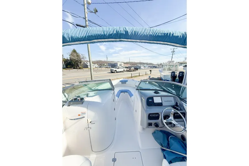 Slide: The Image of 2022 Robalo R227 Dual Console boat interior with Garmin navigation system. - 28