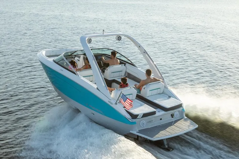 Slide: The Image of Manufacturer Provided Image: 2026 Regal LS4 boat cruising on open water with passengers enjoying the ride. - 4
