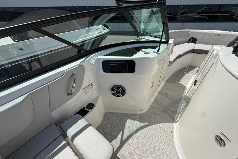Slide: The Image of Interior view of 2026 Sea Ray SDX 250 boat, featuring seating and dashboard. - 13