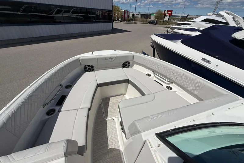 Slide: The Image of 2026 Sea Ray SDX 250 boat interior with spacious seating and modern design. - 16