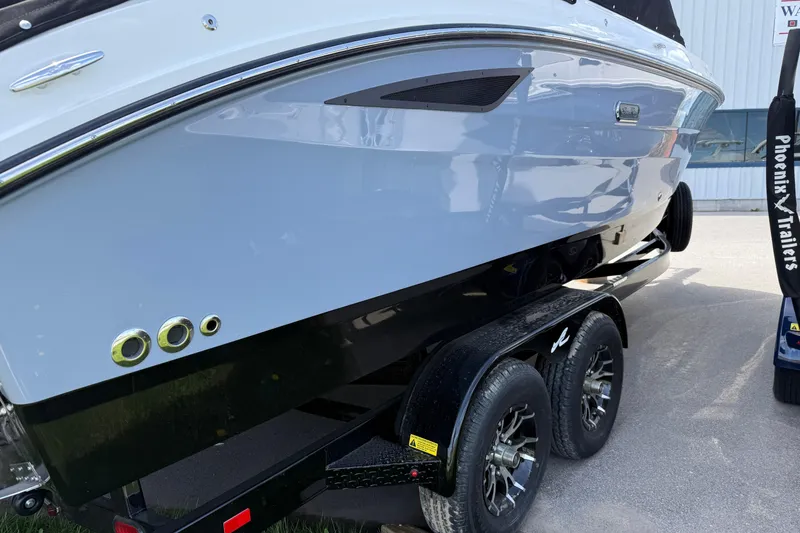 Slide: The Image of 2026 Sea Ray SDX 250 boat on a Phoenix trailer, side view. - 21