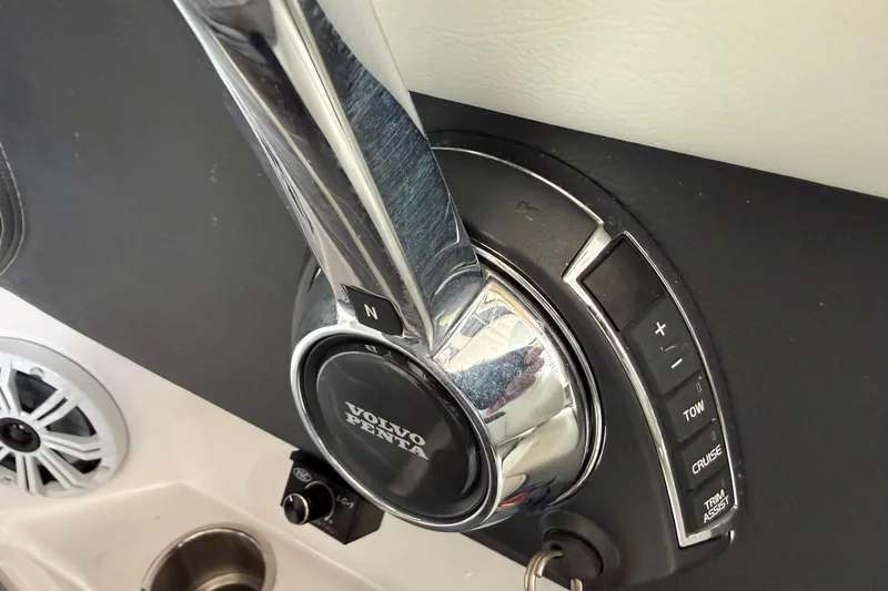 Slide: The Image of 2021 Regal LS4 Surf boat in storage, covered, blue hull, indoor facility. - 11