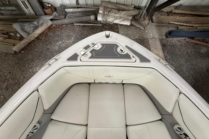 Slide: The Image of Luxurious interior of 2021 Regal LS4 Surf boat with white seating and speakers. - 23