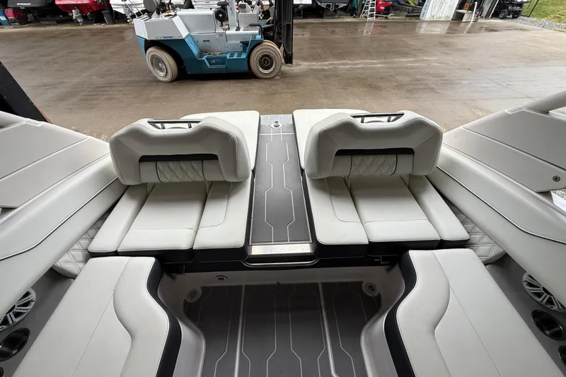 Slide: The Image of 2021 Regal LS4 Surf boat interior with white leather seating and modern design. - 25