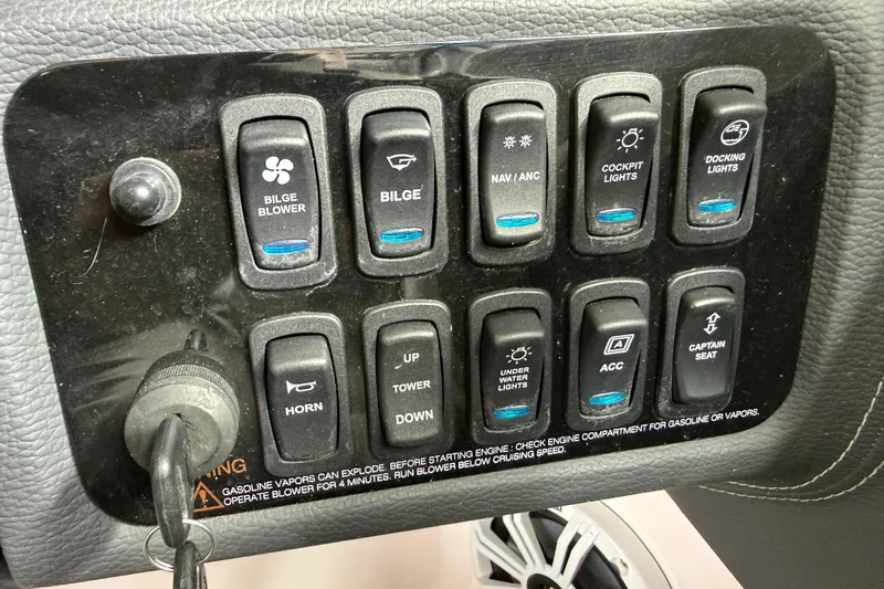 Slide: The Image of 2021 Regal LS4 Surf boat interior with control panel and throttle lever. - 27