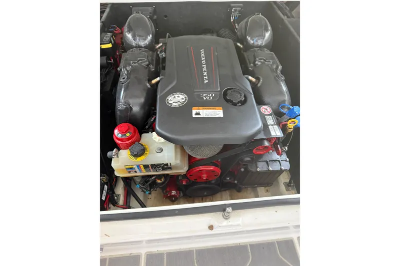 Slide: The Image of Luxurious white seating in 2021 Regal LS4 Surf boat interior with cup holders. - 38