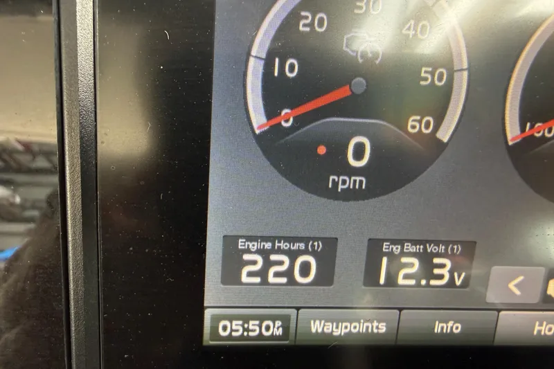 Slide: The Image of 2021 Regal LS4 Surf boat interior with white cushioned seating and cup holders. - 39