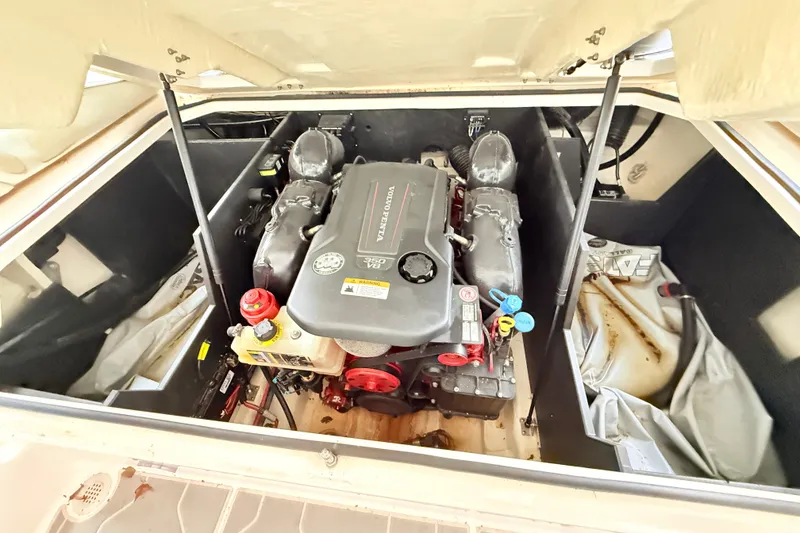 Slide: The Image of 2021 Regal LS4 Surf boat engine compartment with Volvo Penta V8 engine. - 64