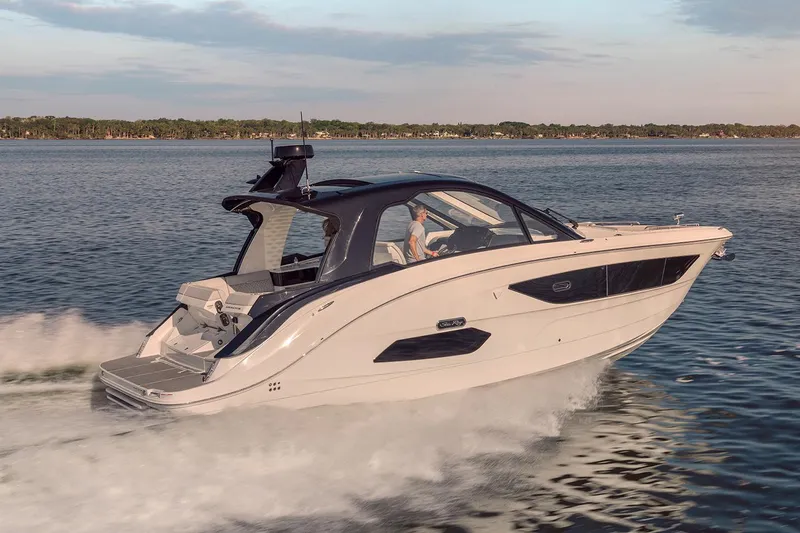 Slide: The Image of 2026 Sea Ray Sundancer 370 yacht on trailer in indoor storage facility. - 2