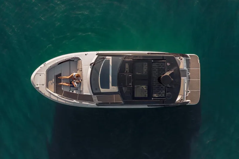 Slide: The Image of Manufacturer Provided Image: 2025 Sea Ray Sundancer 370 cruising on open water at sunset. - 4