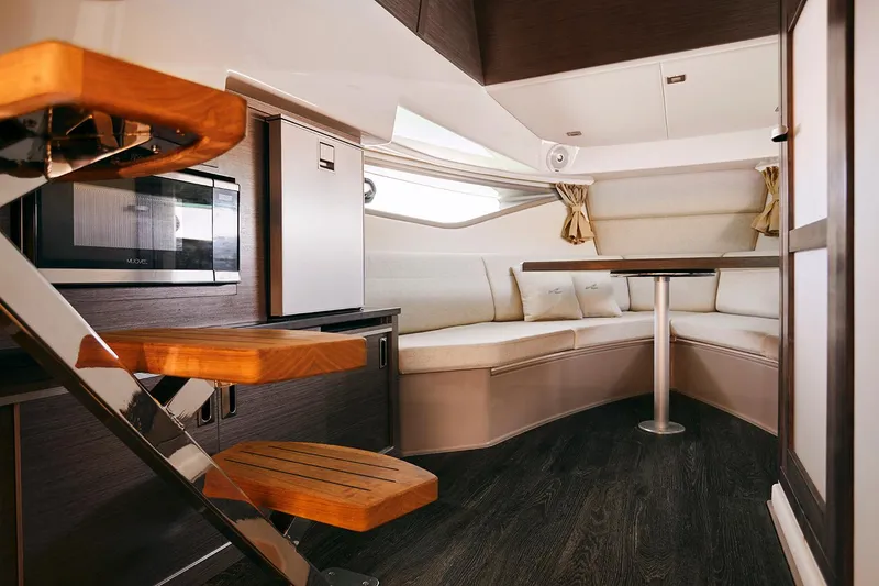Slide: The Image of 2026 Sea Ray Sundancer 320 boat with spacious white sunbed and sleek design. - 14