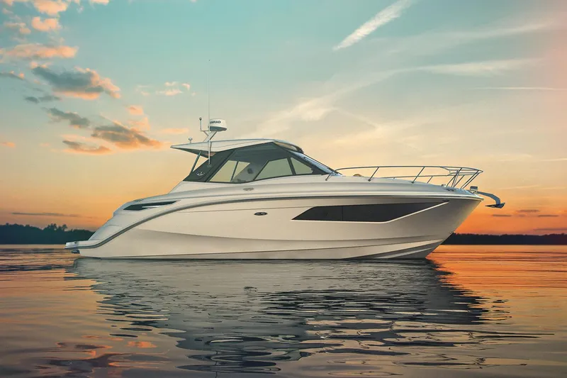 Slide: The Image of 2026 Sea Ray Sundancer 320 yacht, rear view, docked outdoors on a sunny day. - 3