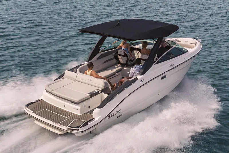 Slide: The Image of Manufacturer Provided Image: 2025 Sea Ray SLX 280 cruising on open water with passengers onboard. - 2