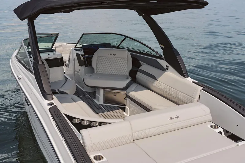 Slide: The Image of Manufacturer Provided Image: 2025 Sea Ray SLX 280 luxury boat interior with plush seating on calm water. - 8