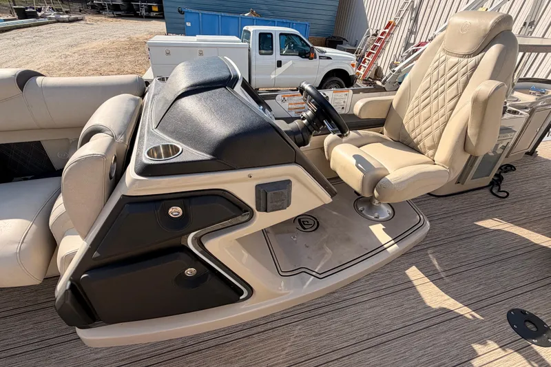Slide: The Image of Luxurious 2021 Premier 250 Grand Majestic boat helm with plush seating and modern controls. - 10