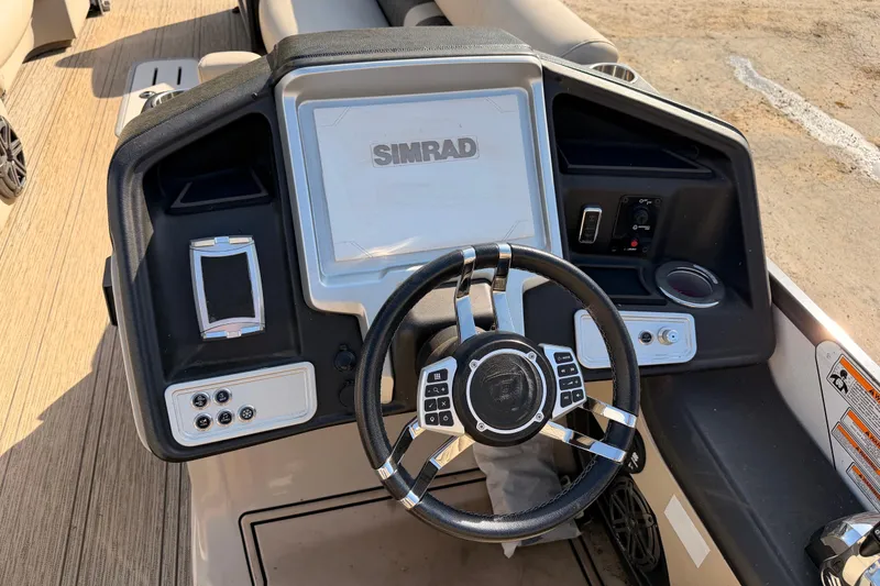 Slide: The Image of Steering console of 2021 Premier 250 Grand Majestic boat with Simrad display. - 11