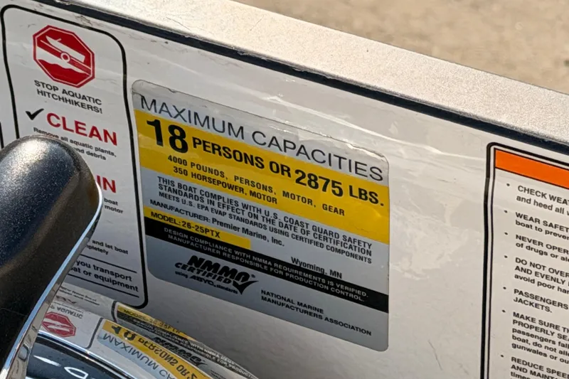 Slide: The Image of Sticker displaying maximum capacities for Premier 250 Grand Majestic, 2021 model, 18 persons or 2875 lbs. - 12