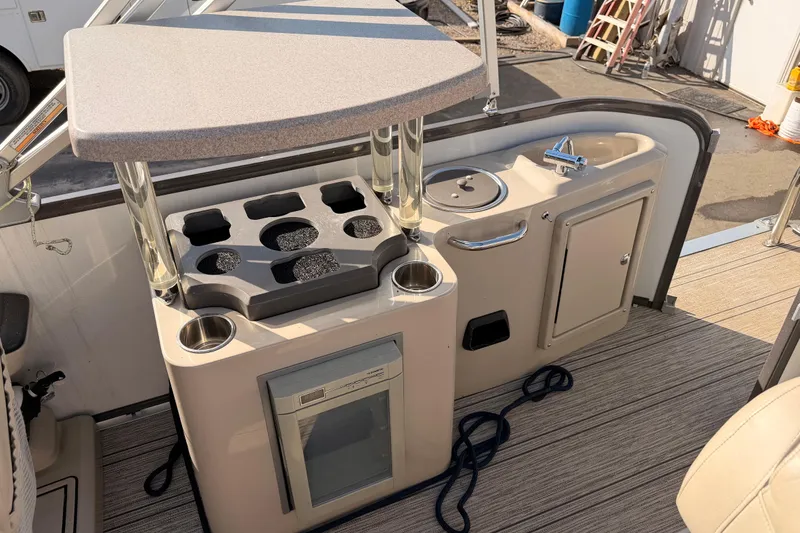 Slide: The Image of Premier 250 Grand Majestic 2021 boat kitchenette with sink and fridge. - 13