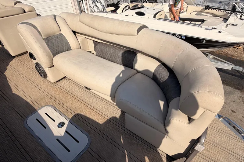 Slide: The Image of Luxurious seating on 2021 Premier 250 Grand Majestic pontoon boat, featuring plush upholstery. - 8