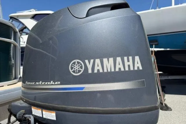 Slide: The Image of Yamaha four-stroke outboard motor on a 2015 Sweetwater 2086 BW boat. - 5
