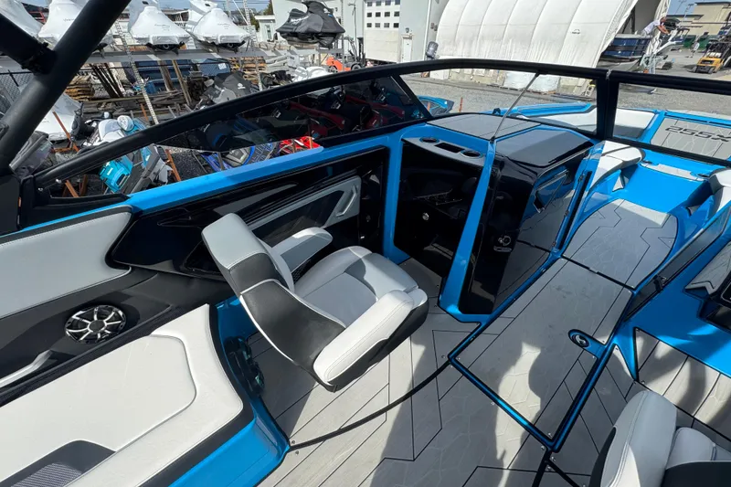 Slide: The Image of 2022 Yamaha Boats 255XD interior with modern seating and sleek design. - 13