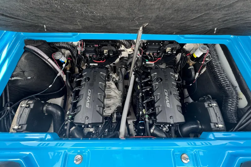 Slide: The Image of Engine compartment of a 2022 Yamaha Boats 255XD, featuring dual SVHO engines. - 3