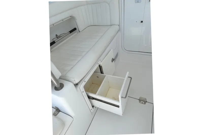 Slide: The Image of Interior of 2008 Southport 28 Tournament Express boat with open storage drawers. - 10