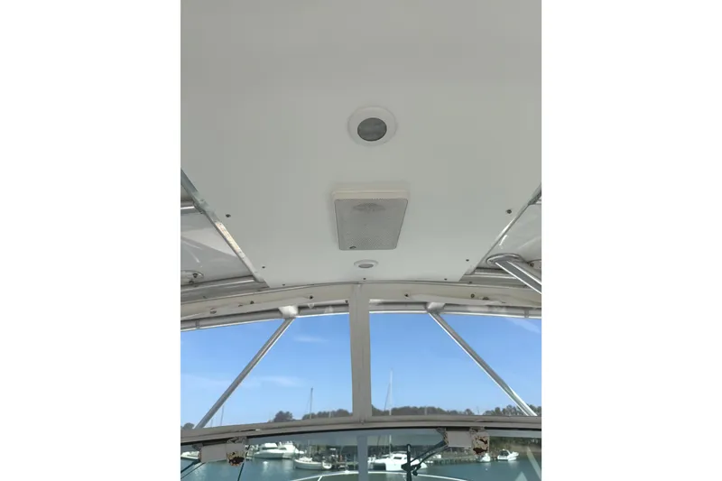 Slide: The Image of 2008 Southport 28 Tournament Express boat interior ceiling view with speaker and light. - 13