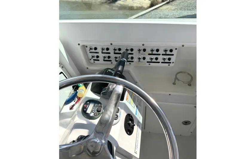 Slide: The Image of Steering wheel and control panel of 2008 Southport 28 Tournament Express boat. - 14