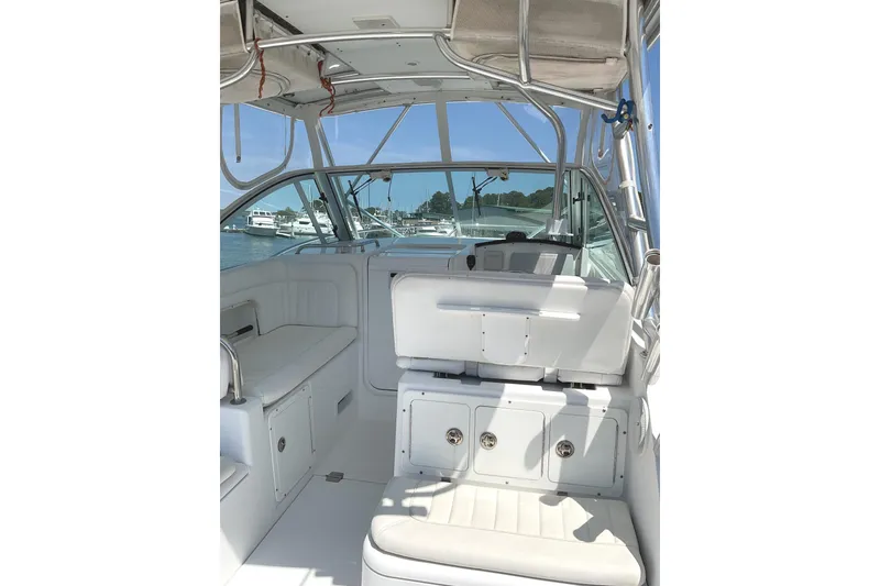 Slide: The Image of Interior view of 2008 Southport 28 Tournament Express boat, featuring seating and storage. - 16